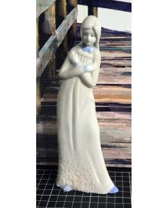 Vintage Porcelain Figurine of a Woman in White Dress