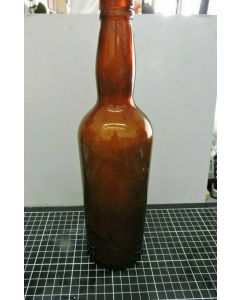 ANTIQUE AMBER EMBOSSED PROPERTY OF NATHAN & WYETH PTY LTD GLASS BOTTLE